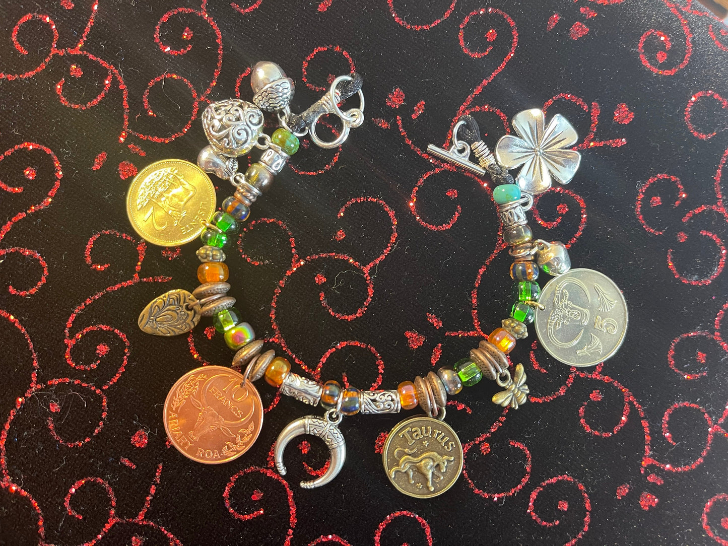 Taurus/Ferdinand the Bull genuine world coin jingle charm bracelet (flower–bell–tinkly heart–bee–moon) Czech glass, silver toggle (zodiac)