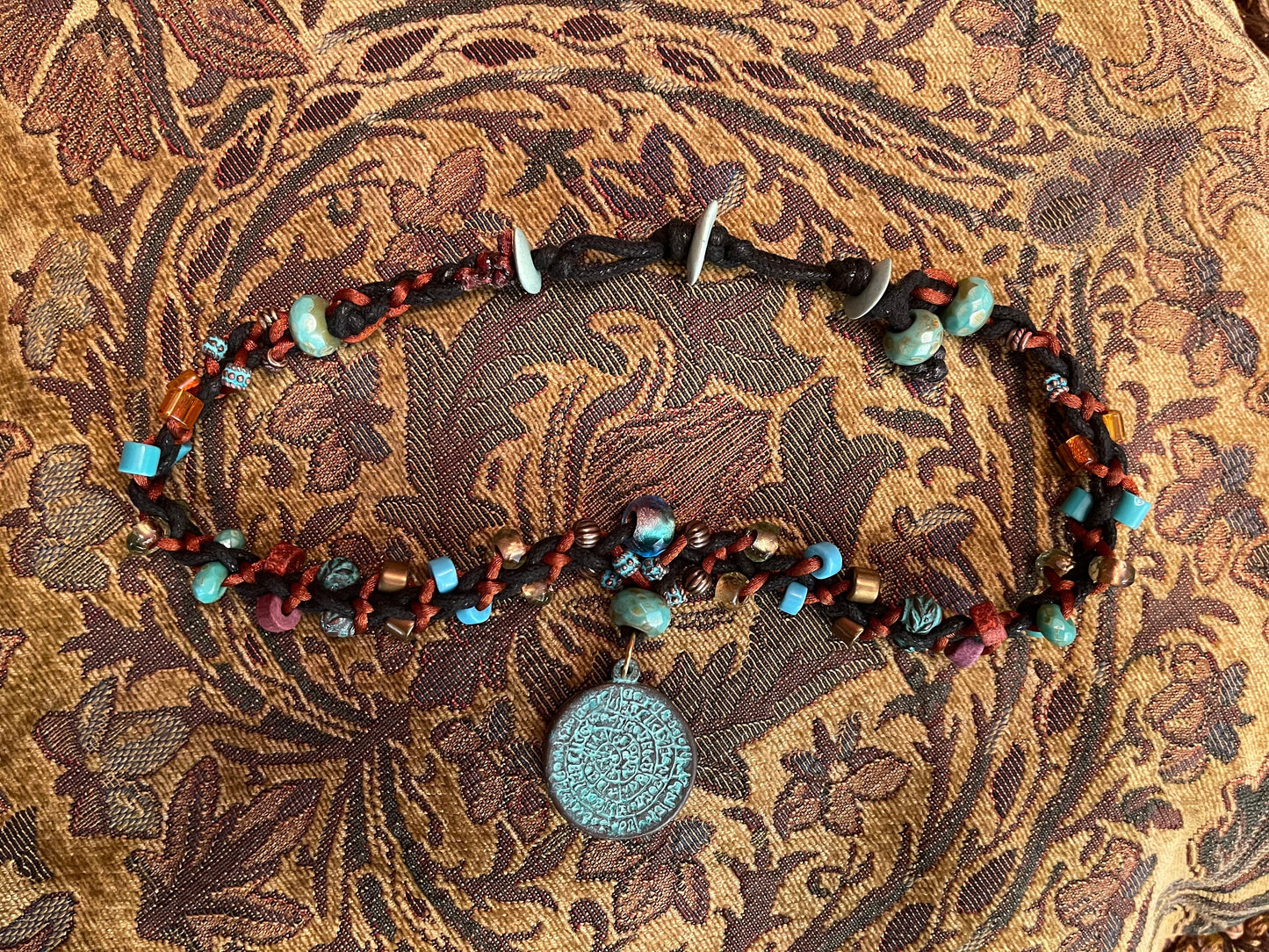 Phaistos Disk necklace–Greek Bronze pendant w Green Patina–fire polished Czech crystal–adjustable button closure–fine archaeological replica