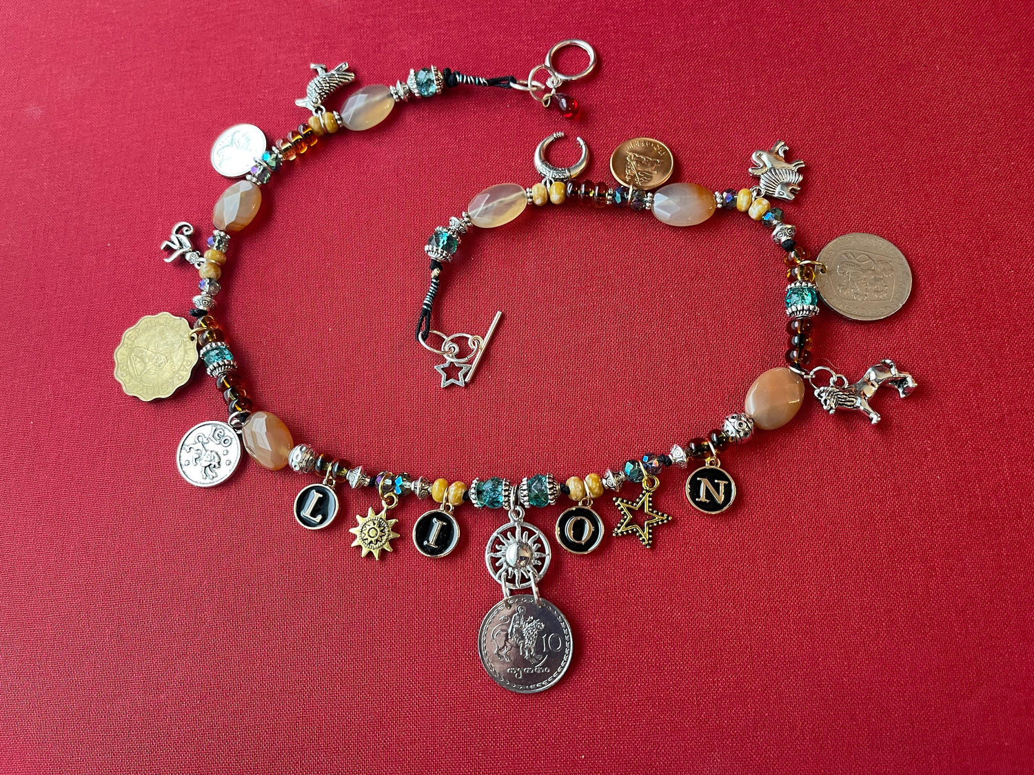 LION Leo necklace–enamel letters, silver toggle–St. Mamas riding lion, Ethiopian lion coins–animal charms–picture jasper–crystal (astrology)