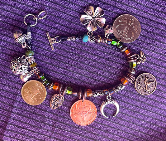 Taurus/Ferdinand the Bull genuine world coin jingle charm bracelet (flower–bell–tinkly heart–bee–moon) Czech glass, silver toggle (zodiac)