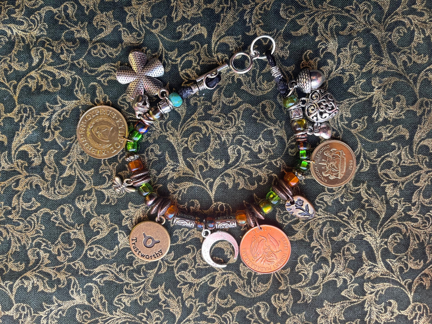 Taurus/Ferdinand the Bull genuine world coin jingle charm bracelet (flower–bell–tinkly heart–bee–moon) Czech glass, silver toggle (zodiac)