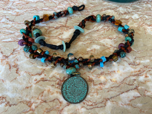 Phaistos Disk necklace–Greek Bronze pendant w Green Patina–fire polished Czech crystal–adjustable button closure–fine archaeological replica