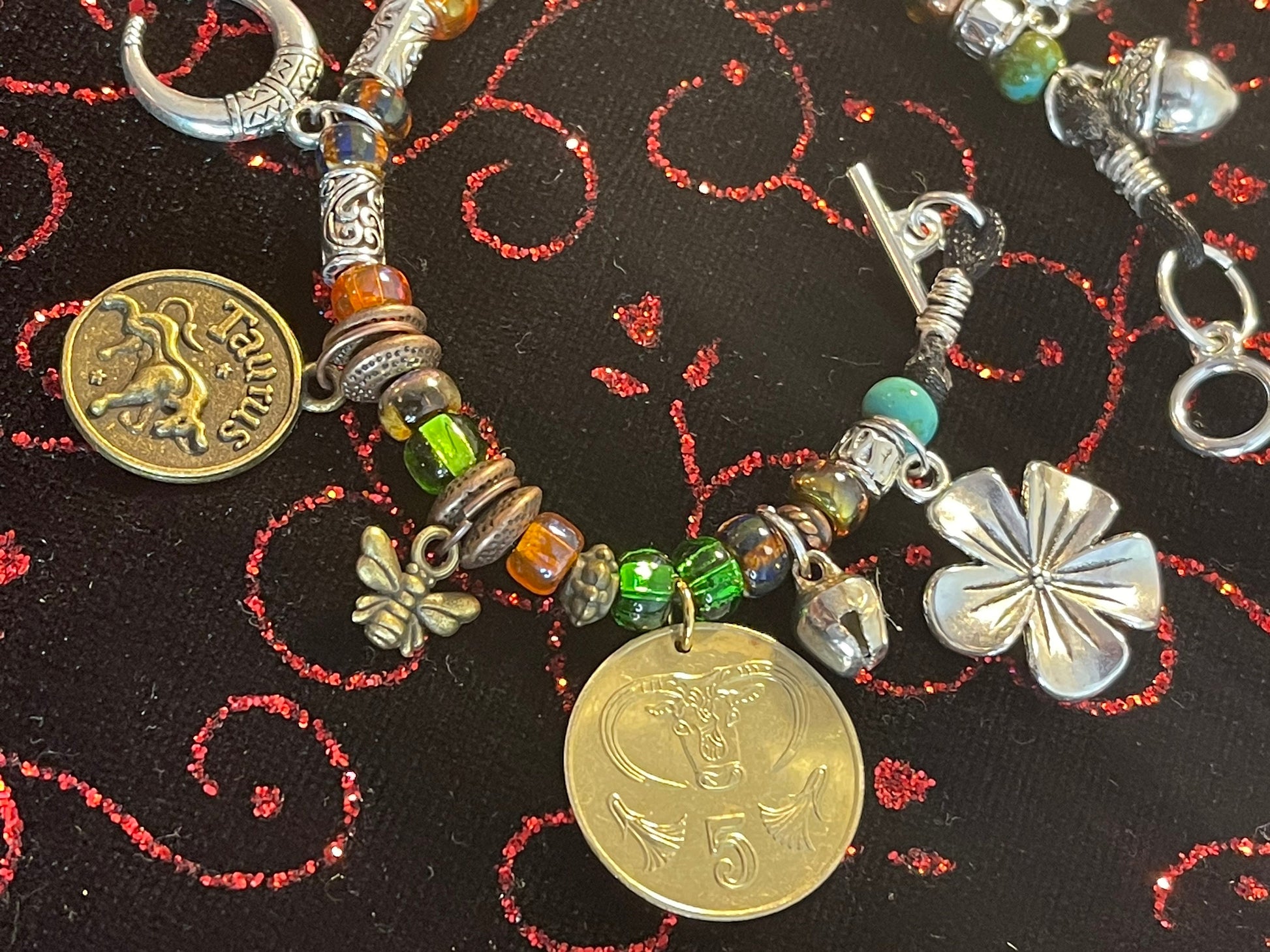 Taurus/Ferdinand the Bull genuine world coin jingle charm bracelet (flower–bell–tinkly heart–bee–moon) Czech glass, silver toggle (zodiac)