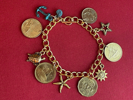 On the High Seas: Gold-plated designer bracelet – ships, starfish, sea turtle, sun, star, nautical–coins, charms– toggle clasp