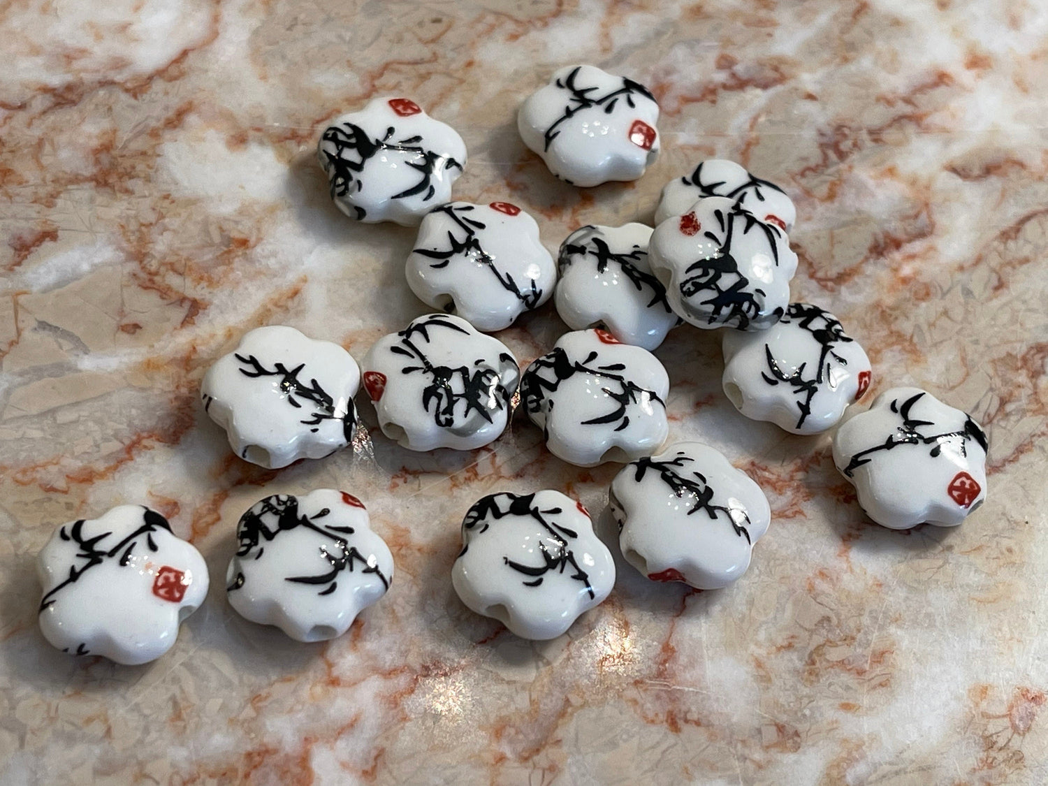 Printed flower-shaped porcelain beads (white with black sumi-e ink bamboo foliage and red seal)–big chunky large hole (lot of 6 or 12 )