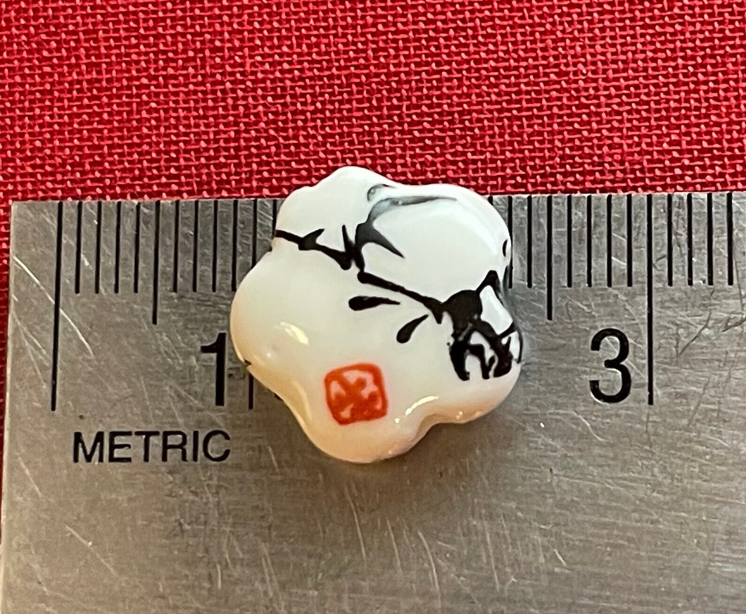 Printed flower-shaped porcelain beads (white with black sumi-e ink bamboo foliage and red seal)–big chunky large hole (lot of 6 or 12 )