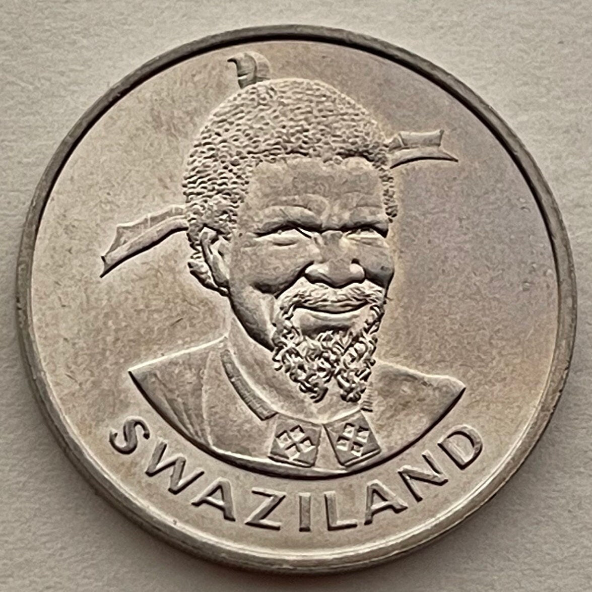 Woman with Beehive Sicolo Hairdo, Husking Corn & King Sobhuza 1 Lilangeni Swaziland Authentic Coin Money for Jewelry (1981) (Eswatini) Maize