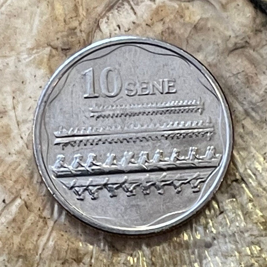 Fautasi Canoe Racers with Mirror Reflections on Water & Tui Ātua Tupua Tamasese Tupuola Tufuga Efi 10 Sene Samoa Authentic Coin for Jewelry